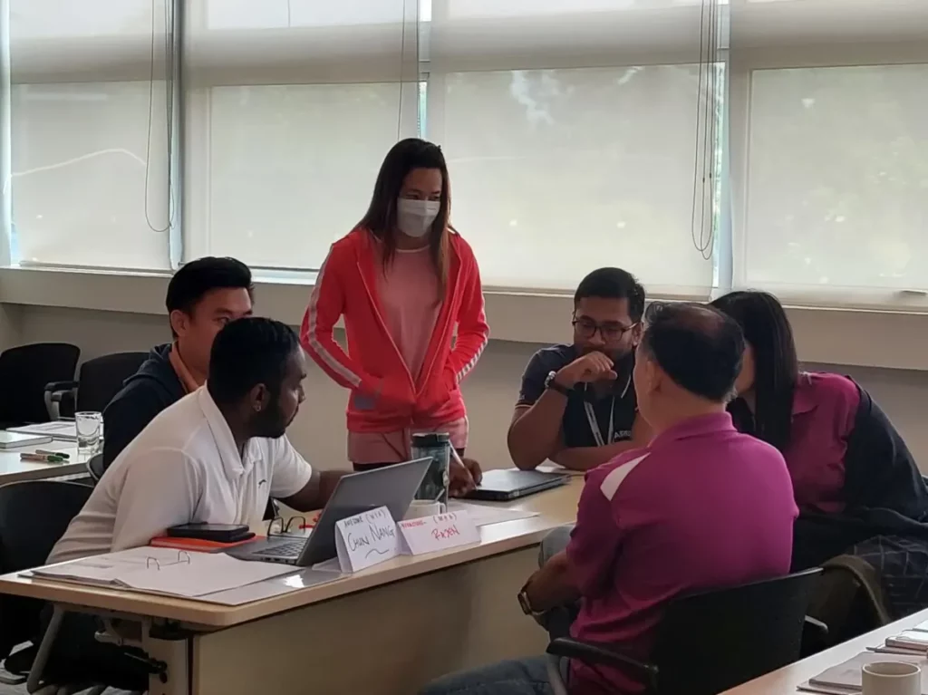 Engaged discussion highlighting effective teamwork and problem-solving facilitated by DoerHRM's employee engagement features.