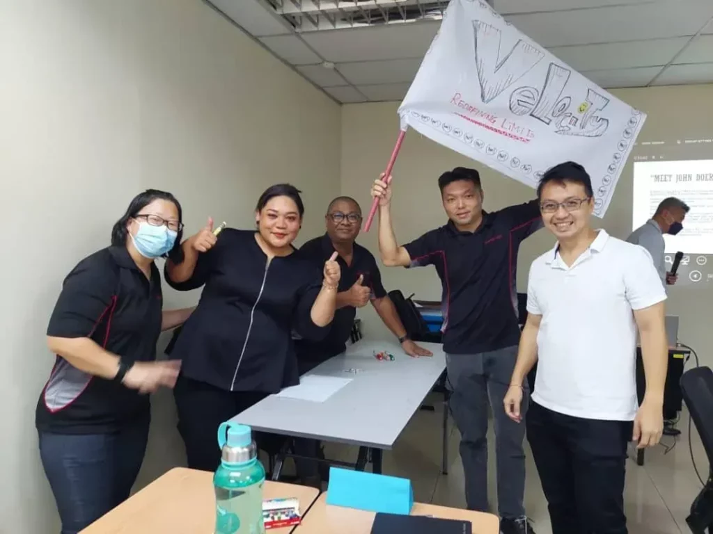Team members celebrating success, illustrating the impact of DoerHRM's reward and recognition system.